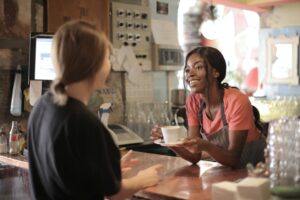A small business coffee shop with people talking
